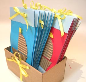 Box full of eco-friendly birthday invitation cards - an attempt to catch them young :-)